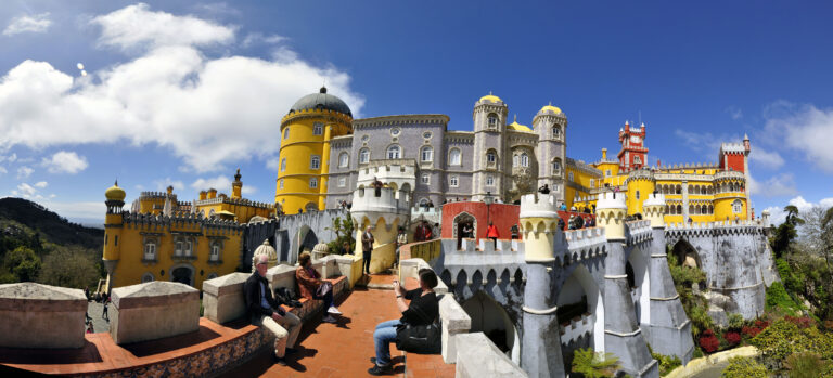 Colorful Pena Palace perched on its hilltop above Sintra, Portugal