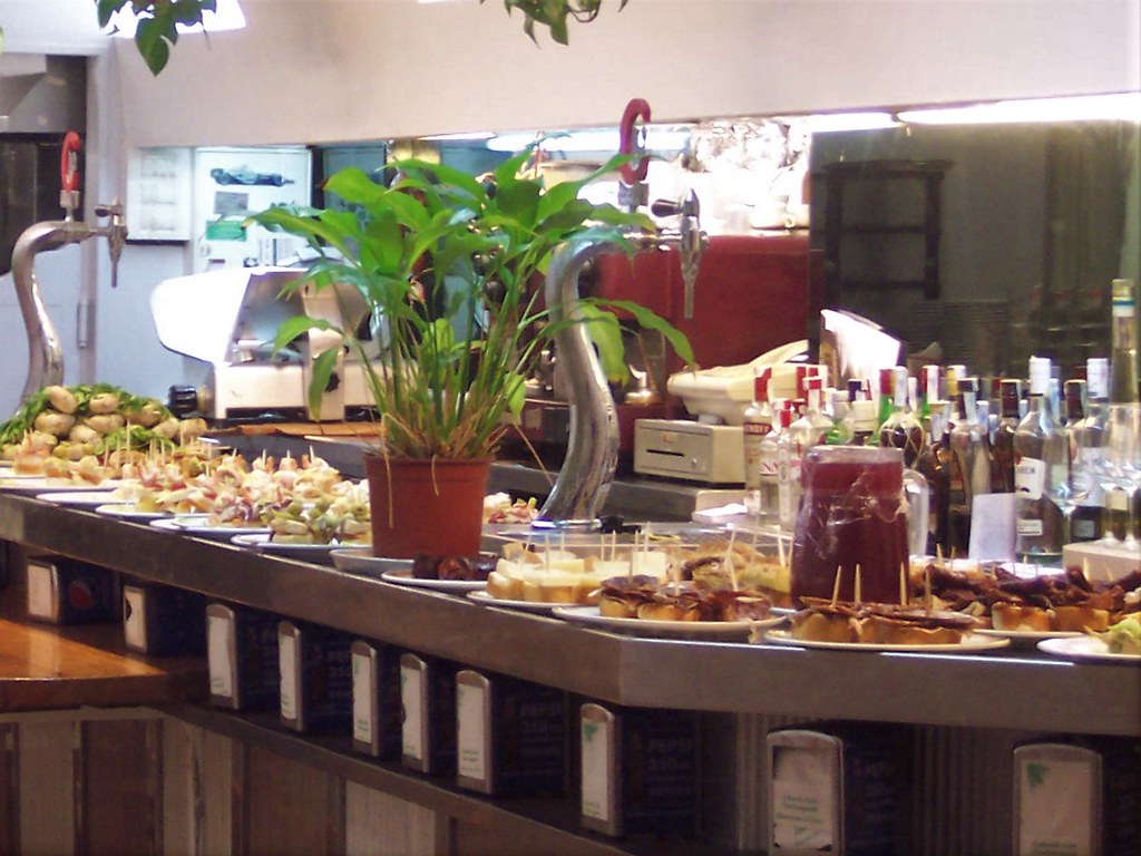 Counter of colorful pintxos at a San Sebastian old town bar