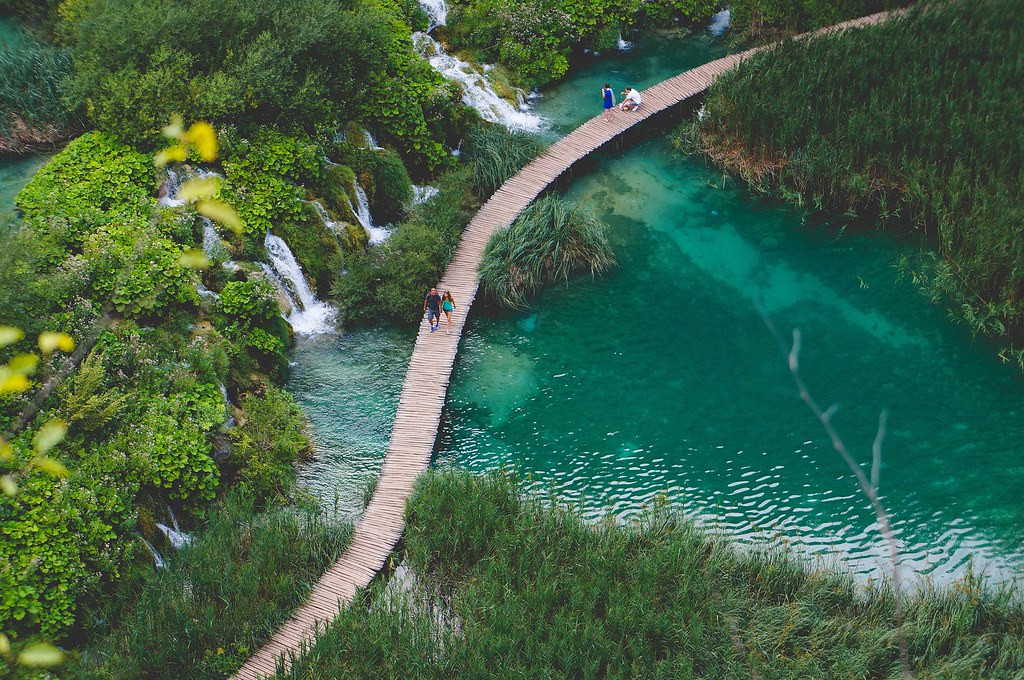 Wooden boardwalk threading through the turquoise lakes at Plitvice Lakes National Park, Croatia