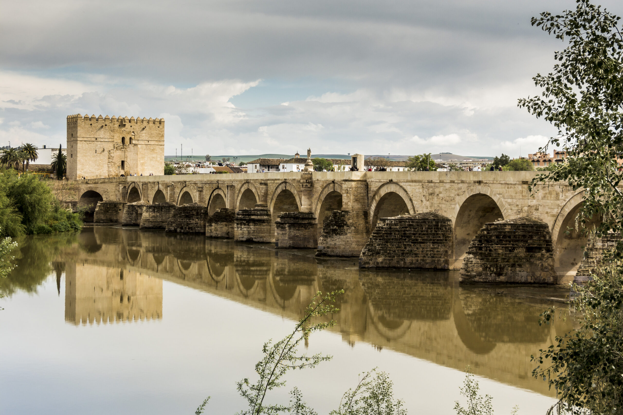 The 16-arch Roman bridge spanning the Guadalquivir river in Cordoba Spain