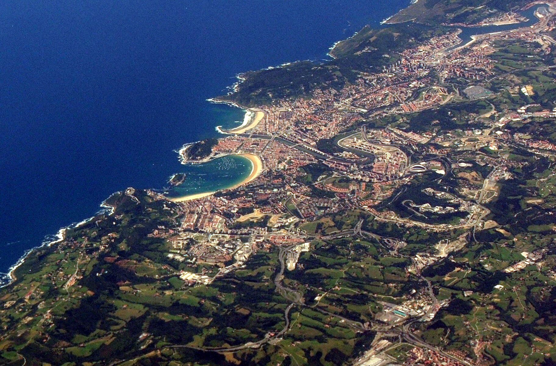 Aerial view of La Concha bay and beach curving around San Sebastian Spain