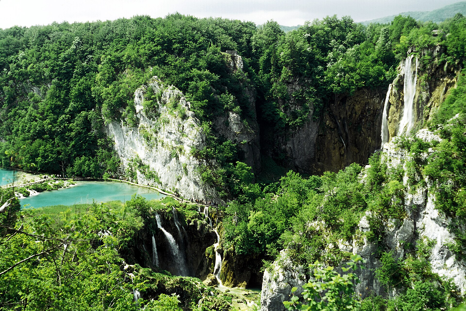 Tall waterfall and turquoise pool in the Lower Lakes canyon at Plitvice Lakes National Park