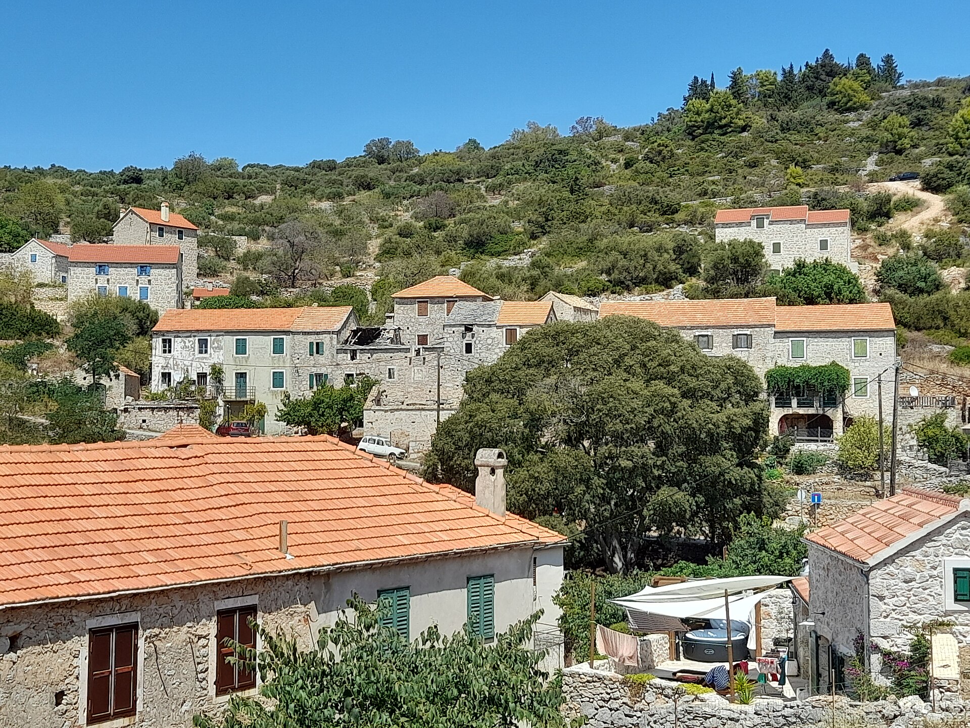 Stone houses with terracotta roofs in the hillside village of Velo Grablje on Hvar