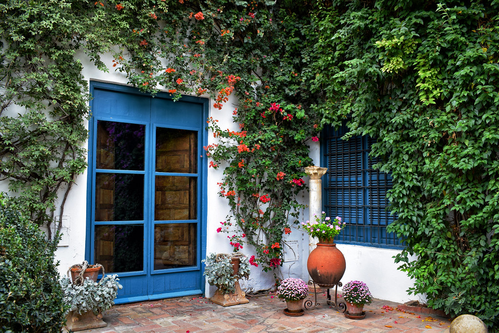 Flower-filled courtyard at Viana Palace in Cordoba Spain