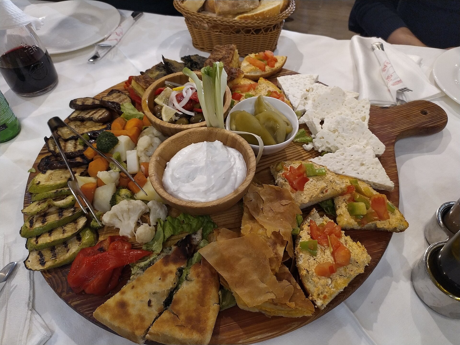 Traditional Albanian meze platter with byrek, cheese and grilled vegetables