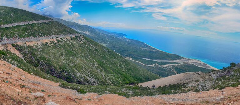 Sweeping view of the Albanian Riviera coastline and Ionian Sea from the Llogara Pass road