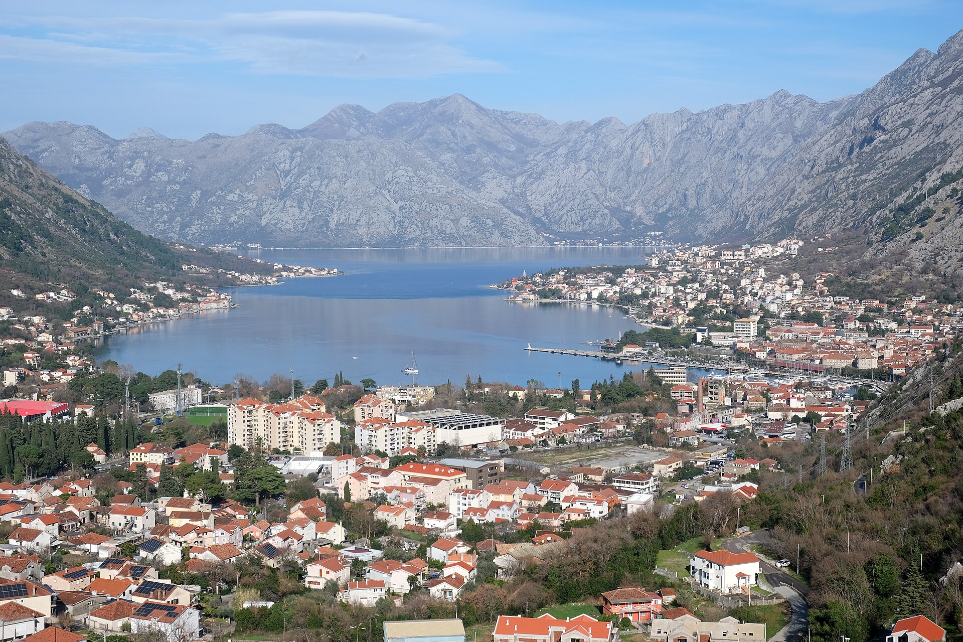 The Bay of Kotor in summer with mountains dropping straight into the Adriatic