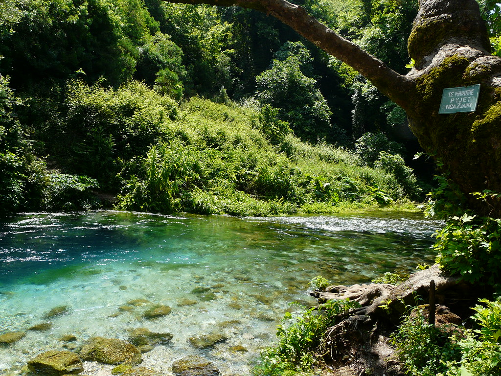 Turquoise water of the Blue Eye spring, Syri i Kalter, surrounded by green forest in southern Albania