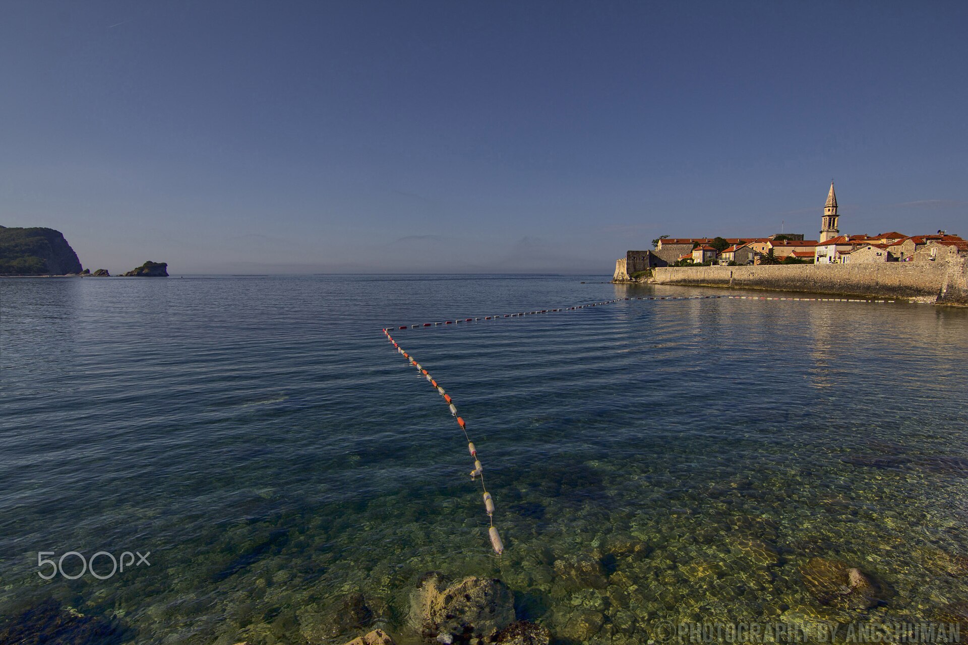 Morning light over the beach and old town of Budva on the Montenegrin coast