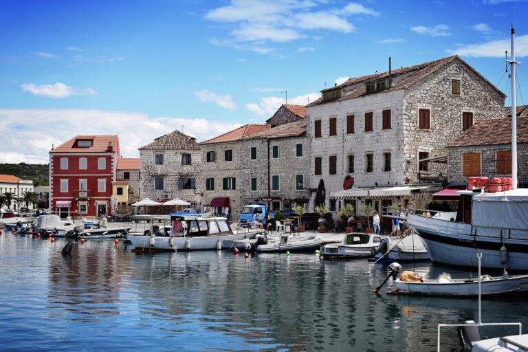 Turquoise Adriatic water and pine covered coastline on Hvar Island in Croatia