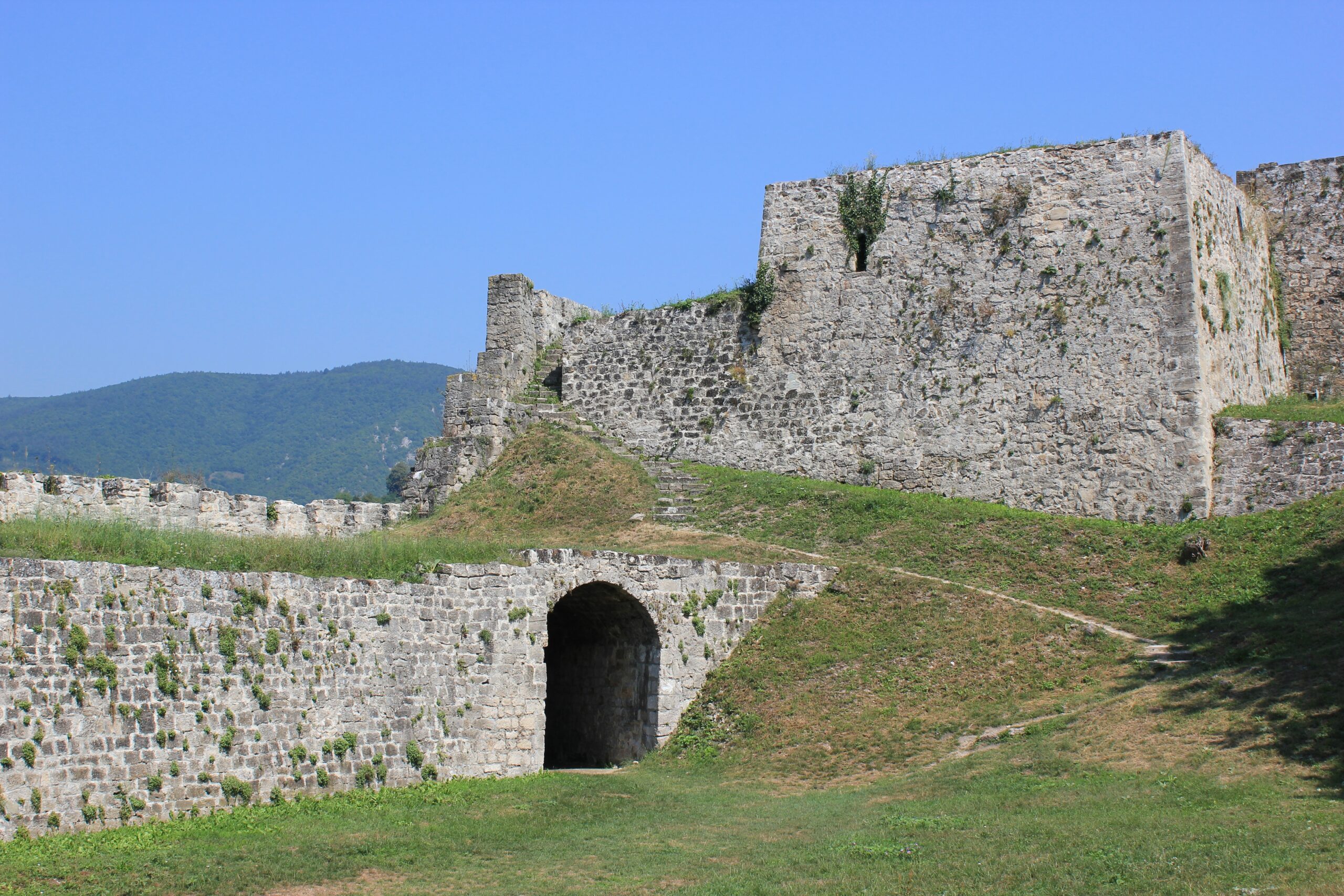 The medieval fortress walls crowning the hill above the old town of Jajce