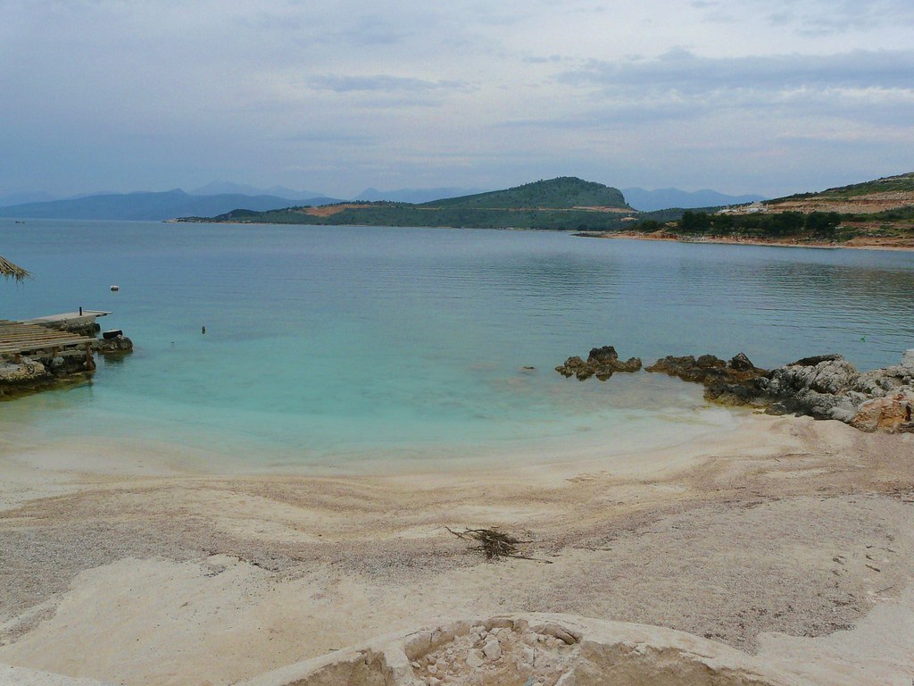 Turquoise water and small islands off the beach in Ksamil, Albania