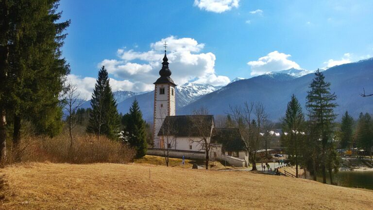 The Church of St John the Baptist and stone bridge at Ribcev Laz on Lake Bohinj
