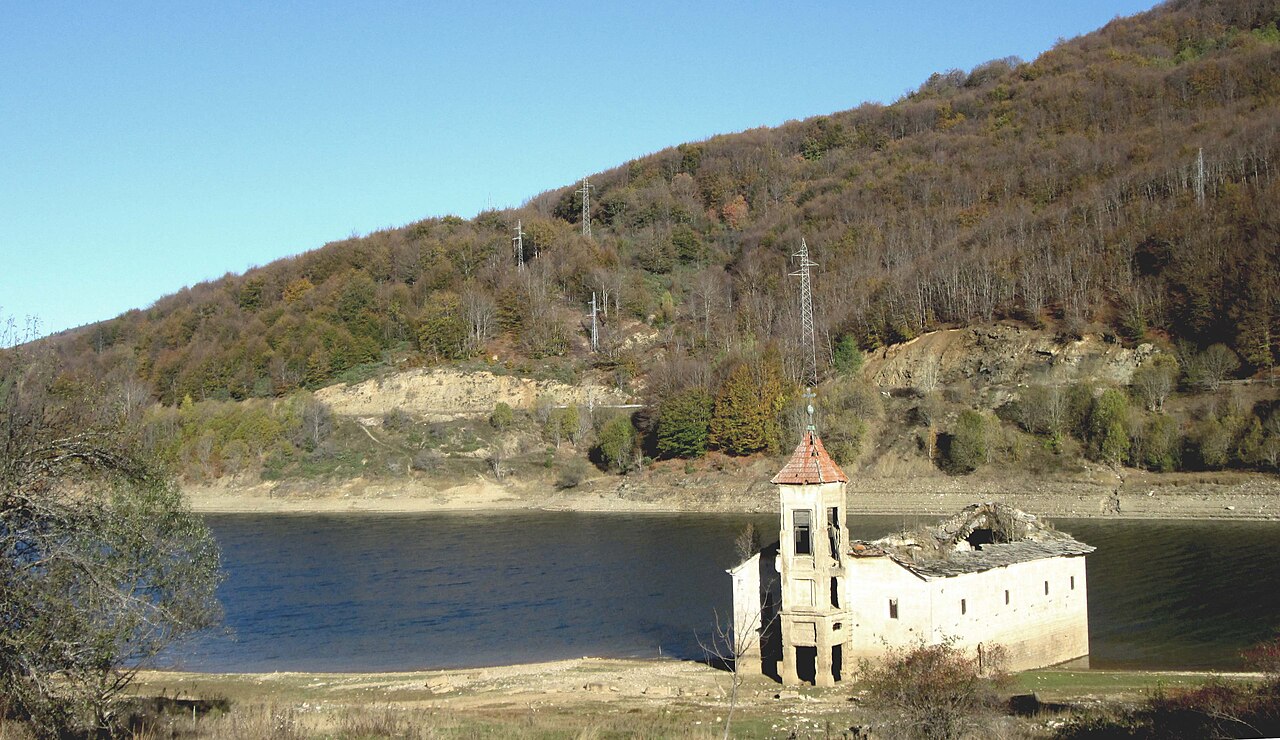 Half submerged Church of St. Nicholas on the shore of Mavrovo Lake in North Macedonia