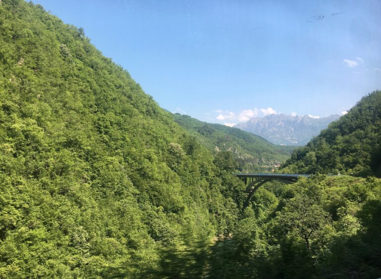 A road winding through the Montenegrin mountains on a ten day road trip route
