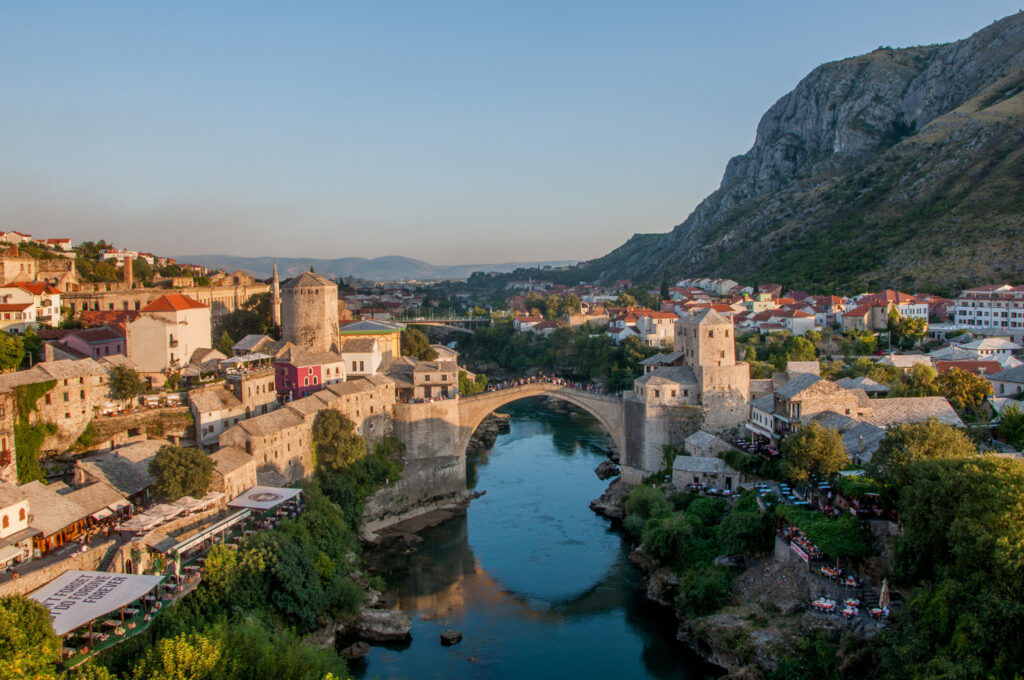 Terracotta rooftops of Mostar old town seen from a minaret above the Neretva valley