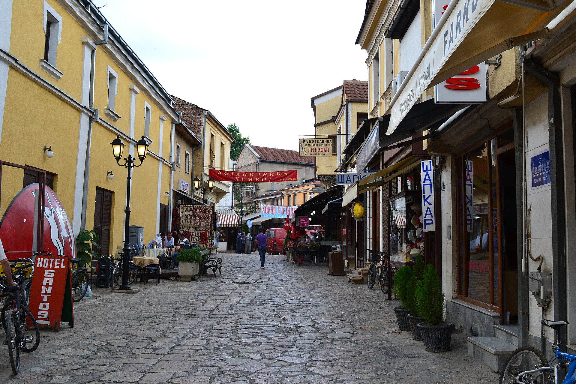 A cobblestone lane lined with shops and cafes in the Old Bazaar of Skopje