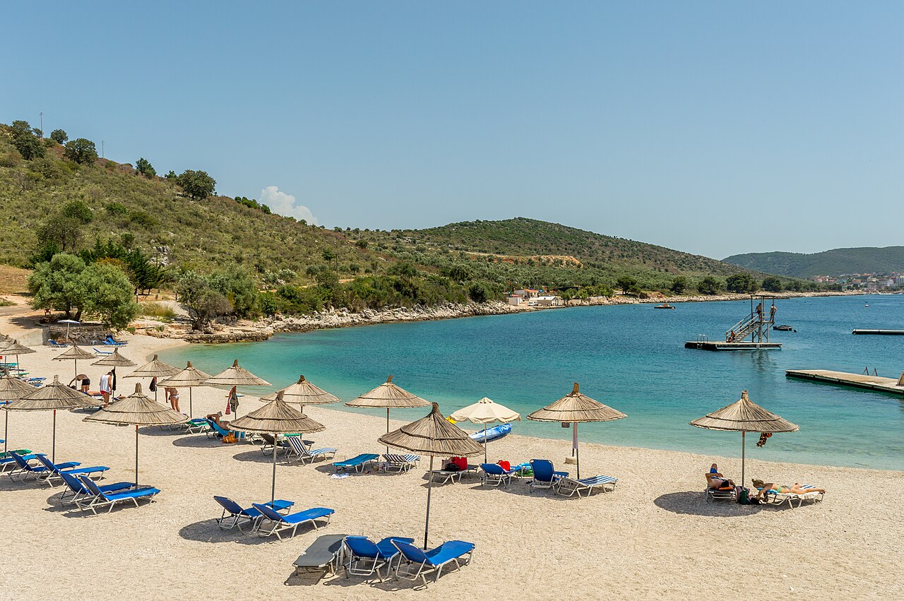 Beach umbrellas and clear water at a beach near Saranda on the Albanian Riviera