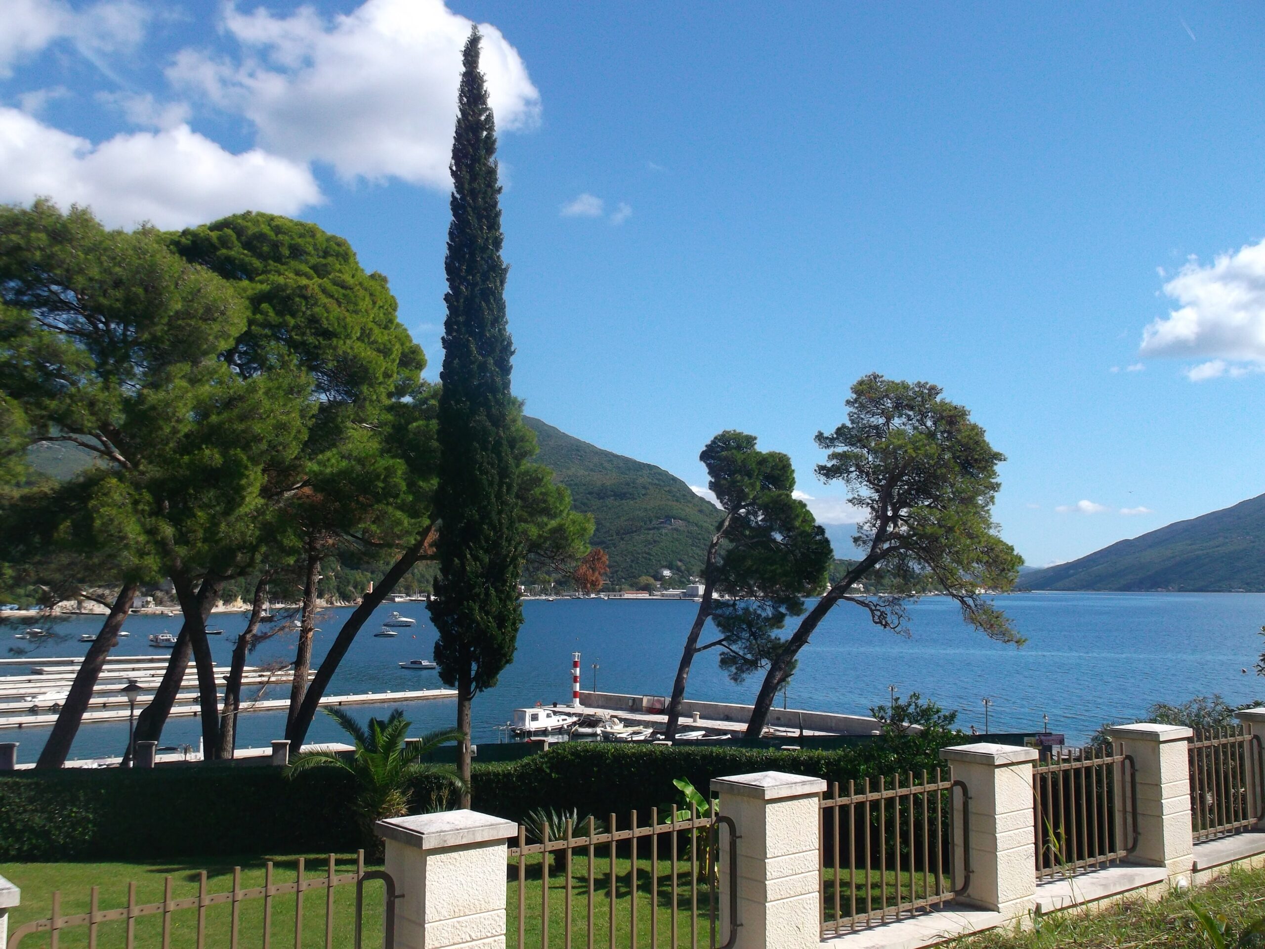 The stone churches of Savina Monastery among cypress trees above the Adriatic in Herceg Novi