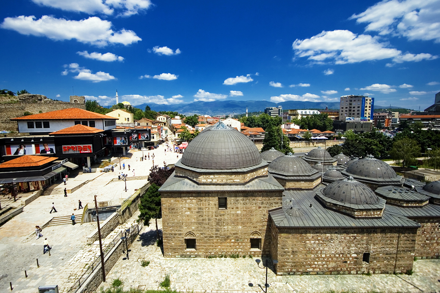 Domes of the Daut Pasha Hamam and the Old Bazaar under blue skies in Skopje, North Macedonia