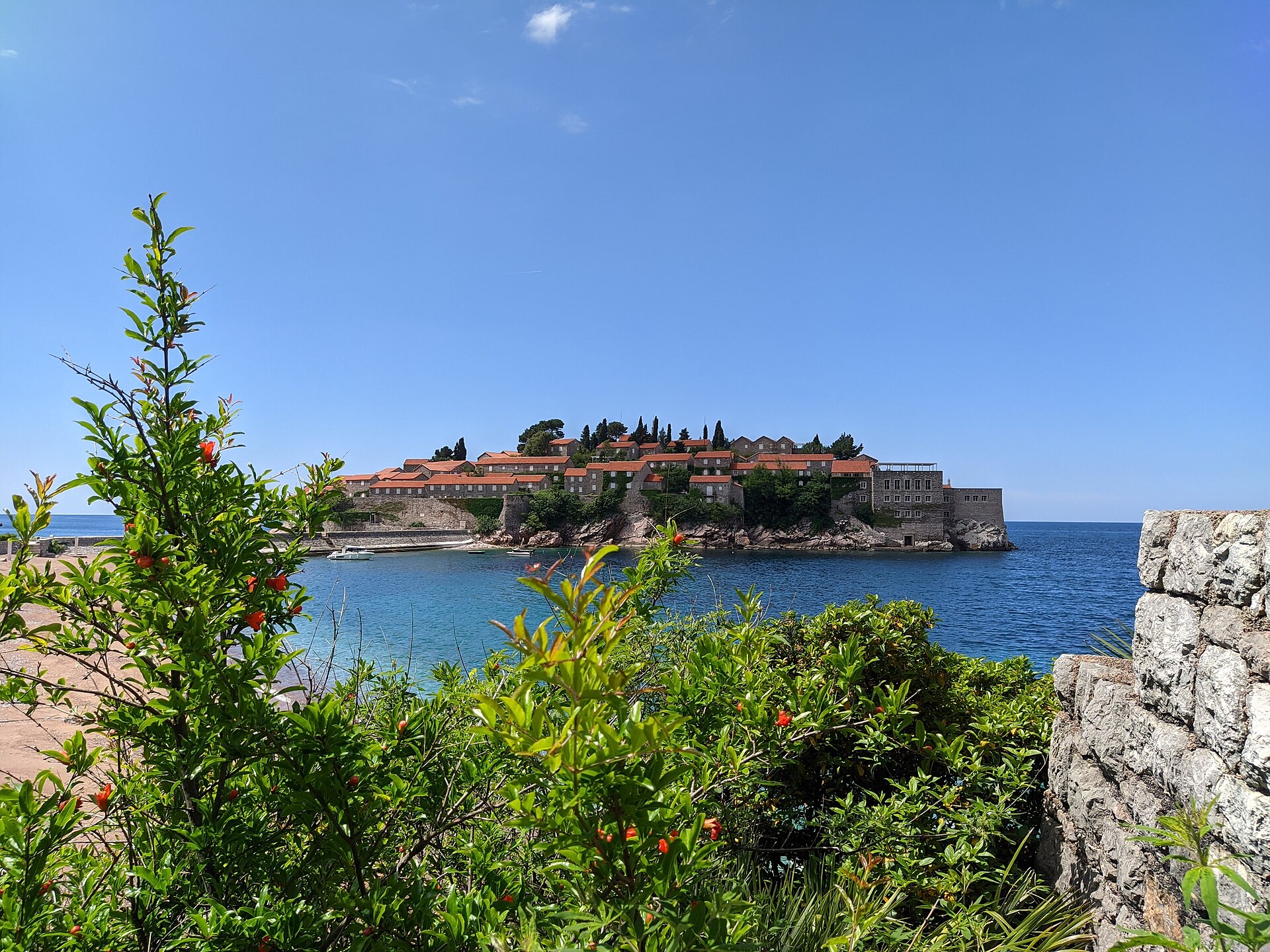 The fortified island of Sveti Stefan linked to the Montenegrin coast by a narrow sand causeway