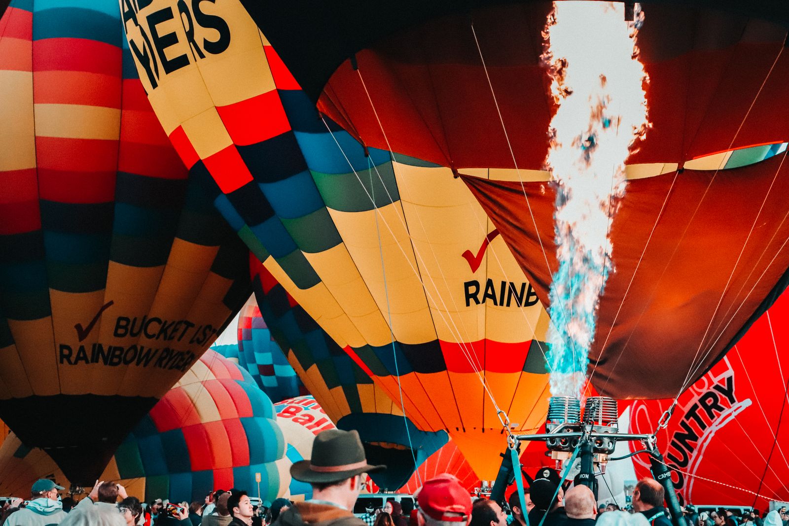 Hot air balloons inflating with flames at the Albuquerque Balloon Fiesta